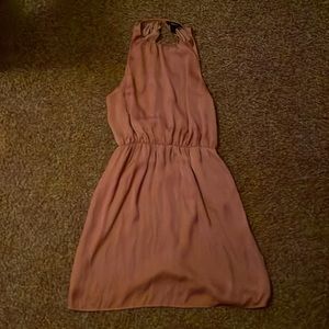This dress is perfect for a girls night out it is a size s color is tan shiny